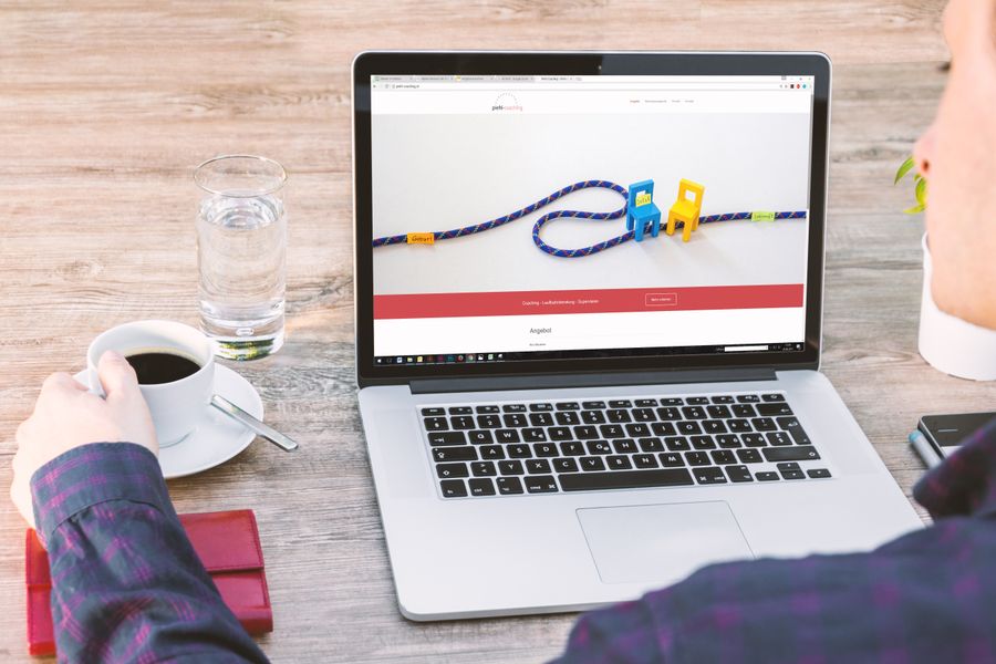 person using website on laptop