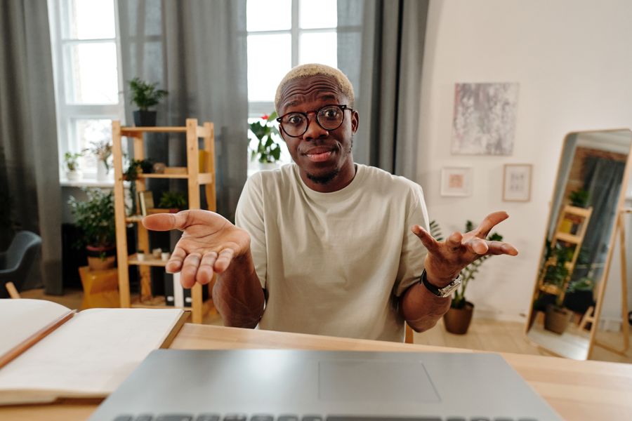 person confused at computer