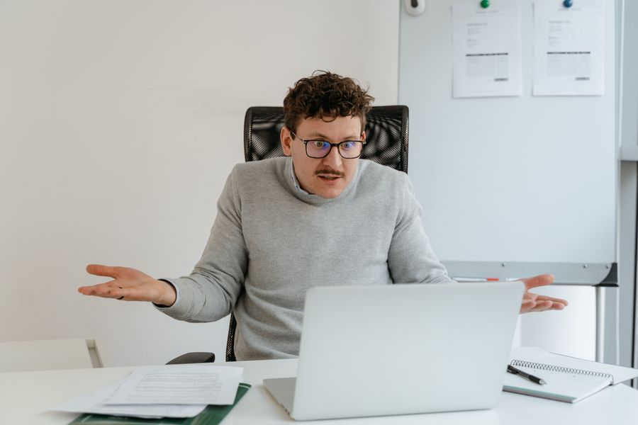person confused at computer