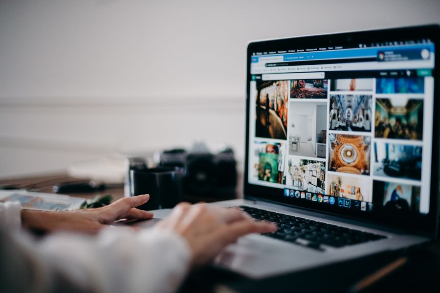 person using website on laptop