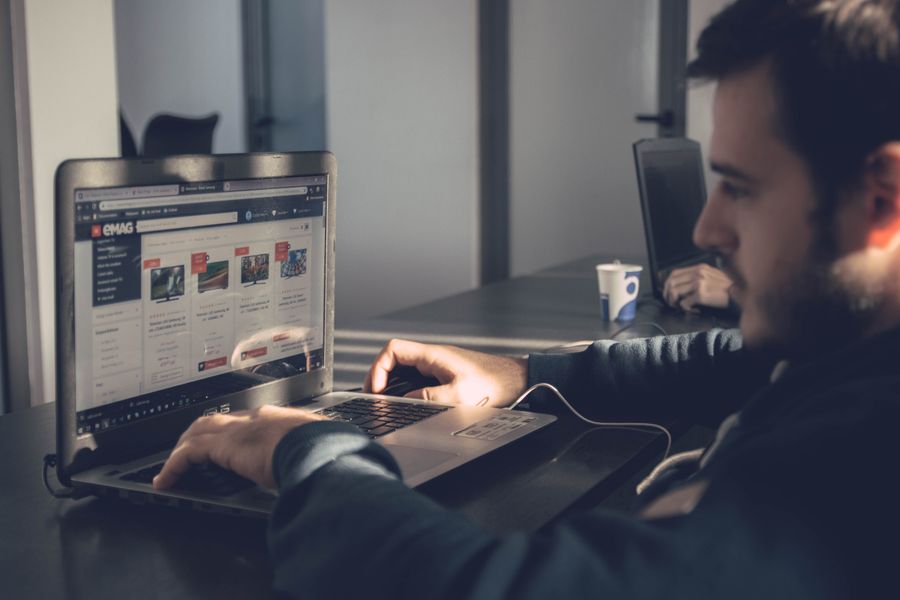person using website on laptop